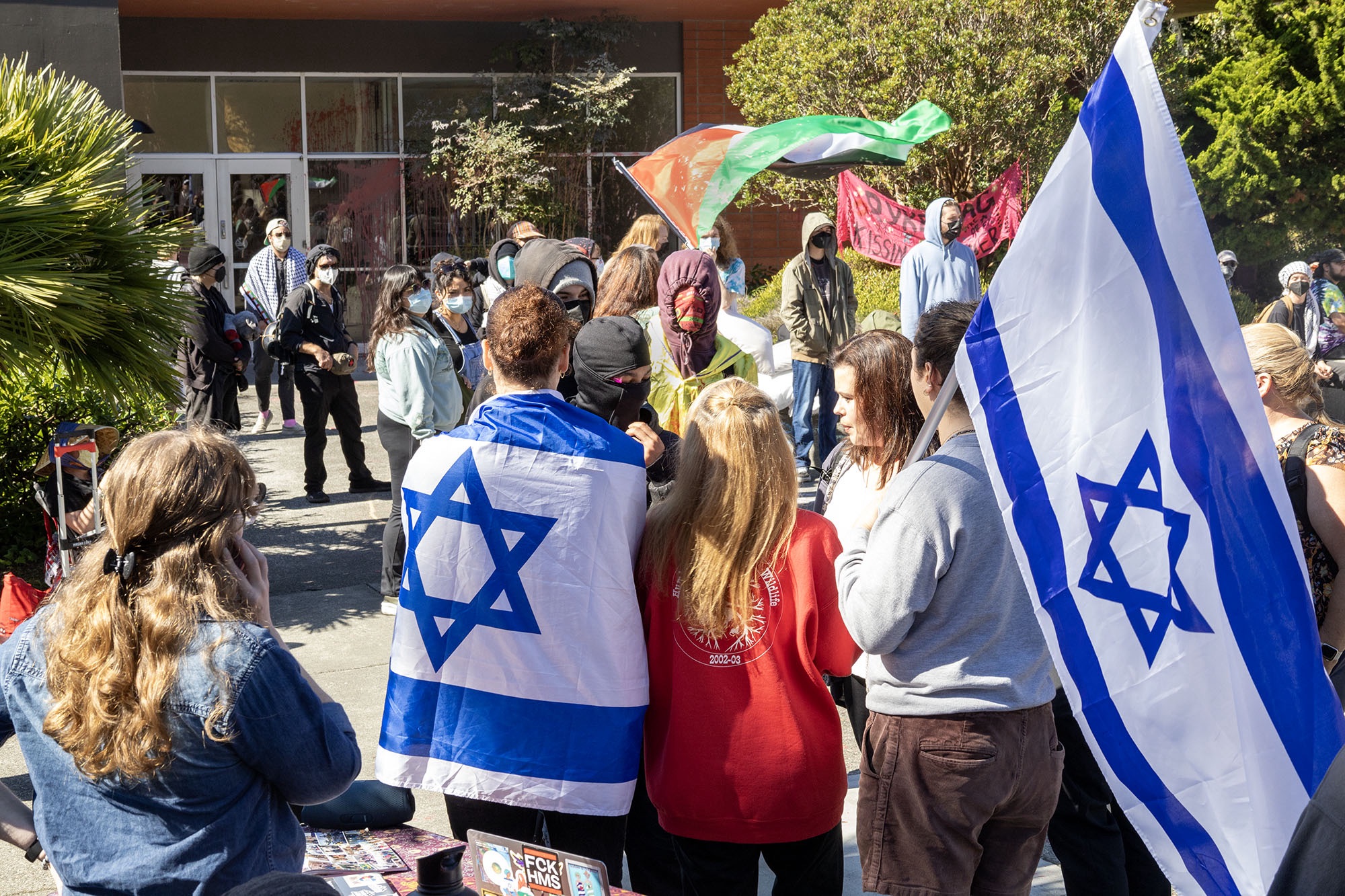 A tale of two protests: paint is spilled and others march to the beat of a different drum